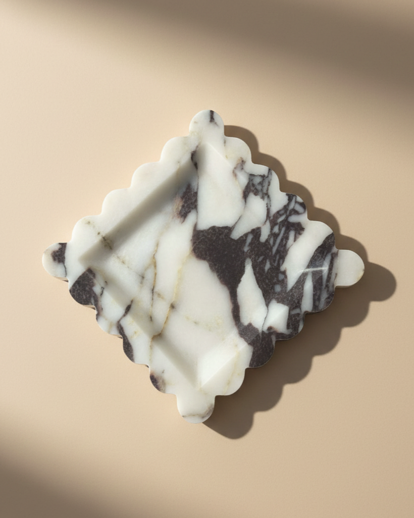 Natural Calacatta Viola Marble Scallop Tray

Our most loved classic calacatta marble from Turkey is a statement for your space.&nbsp;The colour &amp; veining is unique to each cut.

Use it to display an array of your everyday staples, candles, jewellery, skin care, or even as a statement trinket on a coffee table. The options are endless!

Refined, luxurious &amp; polished.


MATERIAL*
Luxurious thick Calacatta Viola marble. approx 2cm.