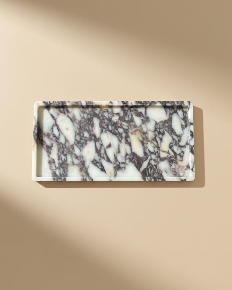 Natural Large Calacatta Viola Marble Tray

Our most loved classic calacatta marble from Turkey is a statement for your space.&nbsp;The colour &amp; veining is unique to each cut.

Use it to display an array of your candles, perfume, skin care, in your kitchen or coffee station or even as a statement piece on a coffee table. The options are endless!

Refined, luxurious &amp; polished.


MATERIAL*
Luxurious thick Calacatta Viola marble. approx 2cm.

As our pieces are crafted from natural stone, slight variati
