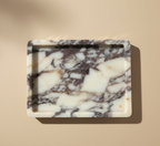 Natural Calacatta Viola Marble Medium Rectangular Cut Tray

Our most loved classic calacatta marble from Turkey is a statement for your space.&nbsp;The colour &amp; veining is unique to each cut.

Use it to display an array of your everyday staples, candles, jewellery, skin care, or even as a statement trinket on a coffee table. The options are endless!

Refined, luxurious &amp; polished.


MATERIAL*
Luxurious thick Calacatta Viola marble. approx 2cm.

As our pieces are crafted from natural stone, slight va