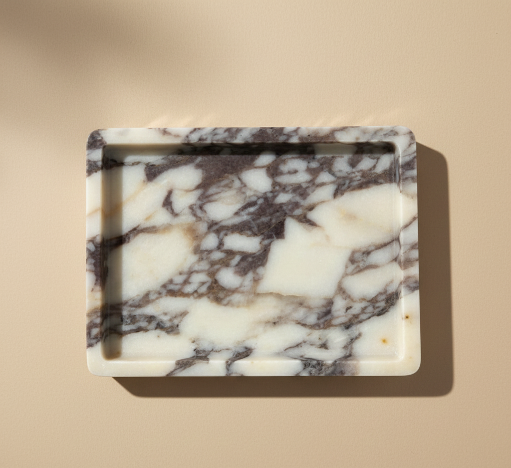 Natural Calacatta Viola Marble Medium Rectangular Cut Tray

Our most loved classic calacatta marble from Turkey is a statement for your space.&nbsp;The colour &amp; veining is unique to each cut.

Use it to display an array of your everyday staples, candles, jewellery, skin care, or even as a statement trinket on a coffee table. The options are endless!

Refined, luxurious &amp; polished.


MATERIAL*
Luxurious thick Calacatta Viola marble. approx 2cm.

As our pieces are crafted from natural stone, slight va