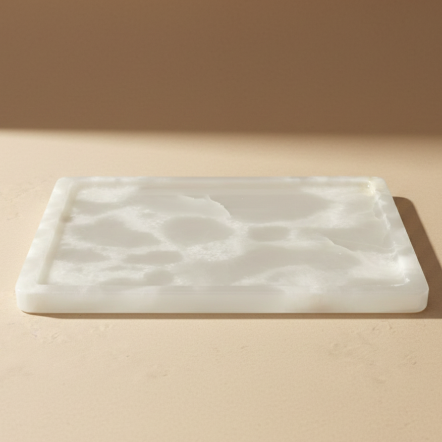 Natural White Onyx Marble Tray
Our elegant natural white onyx marble is guaranteed to refine you space. The colour & veining is unique to each cut.

Use it to display an array of your everyday staples, candles, jewellery, skin care, or even as a statement trinket on a coffee table. The options are endless!